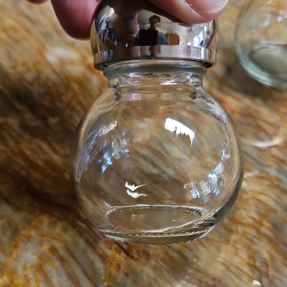 Clear Glass Salt and Pepper Shakers with Silver Tops